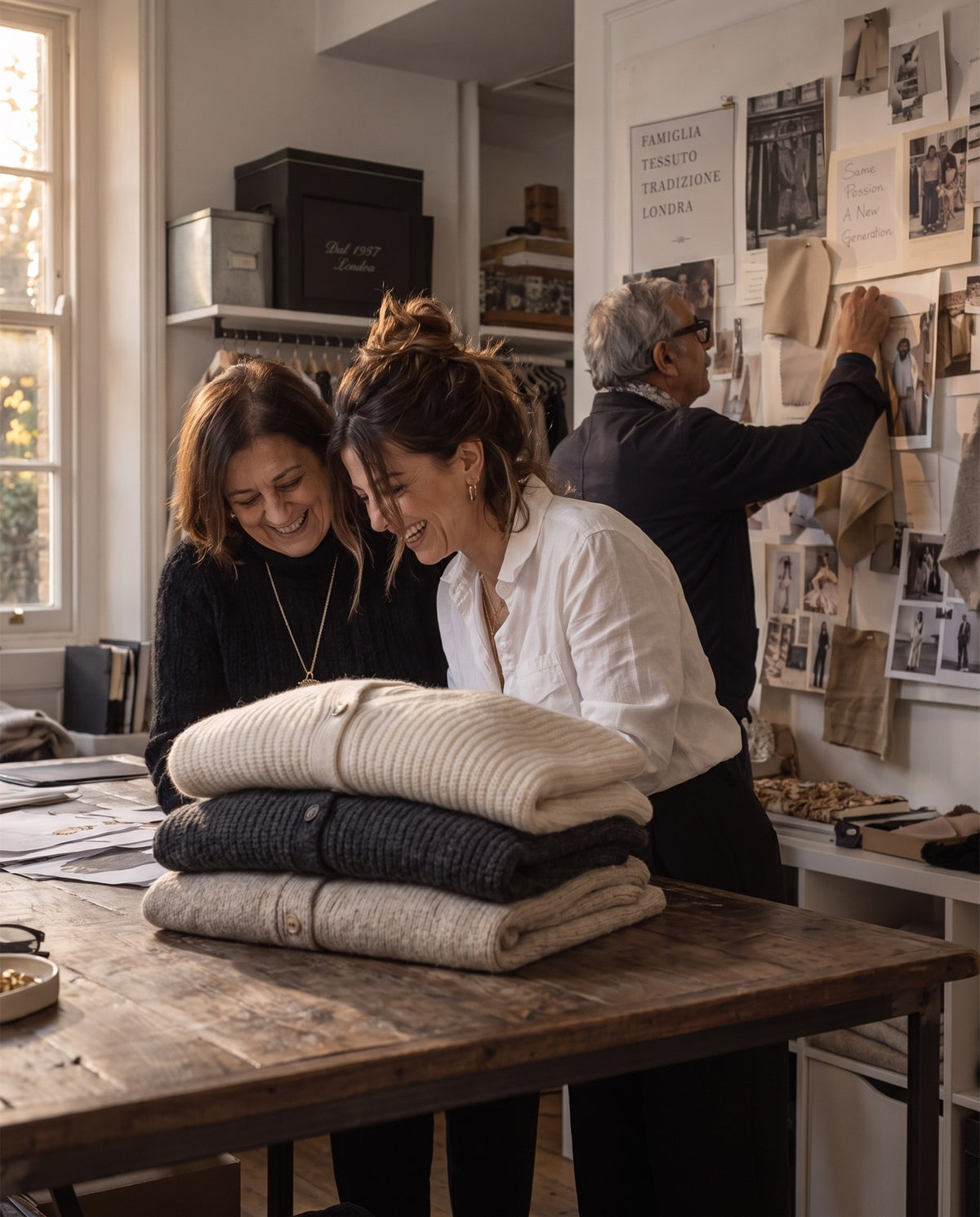 Giulia and Sofia with knitted cardigans in the Bellini & Rossi London workroom
